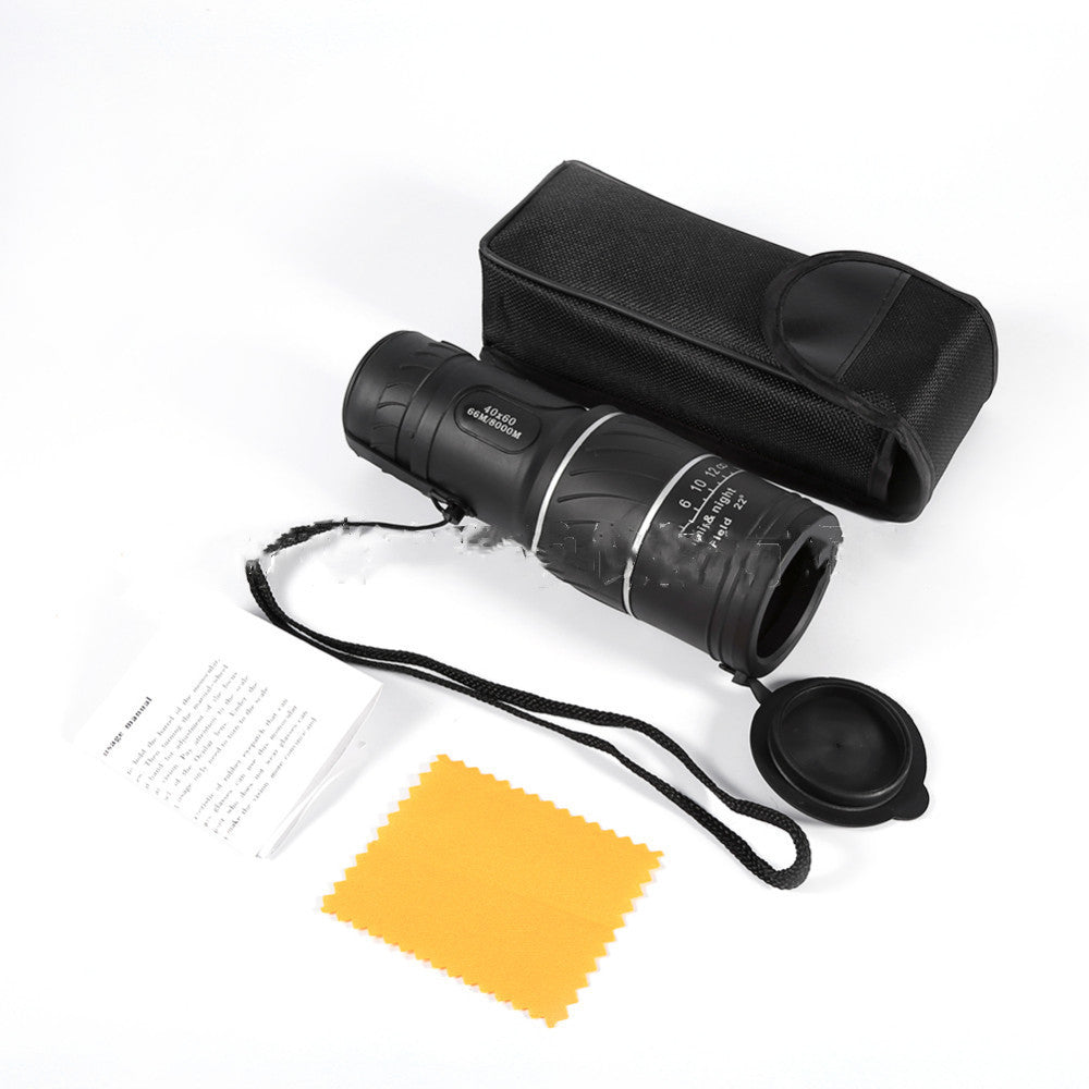 Black monocular with carrying case, cleaning cloth, and lens pen on a white background