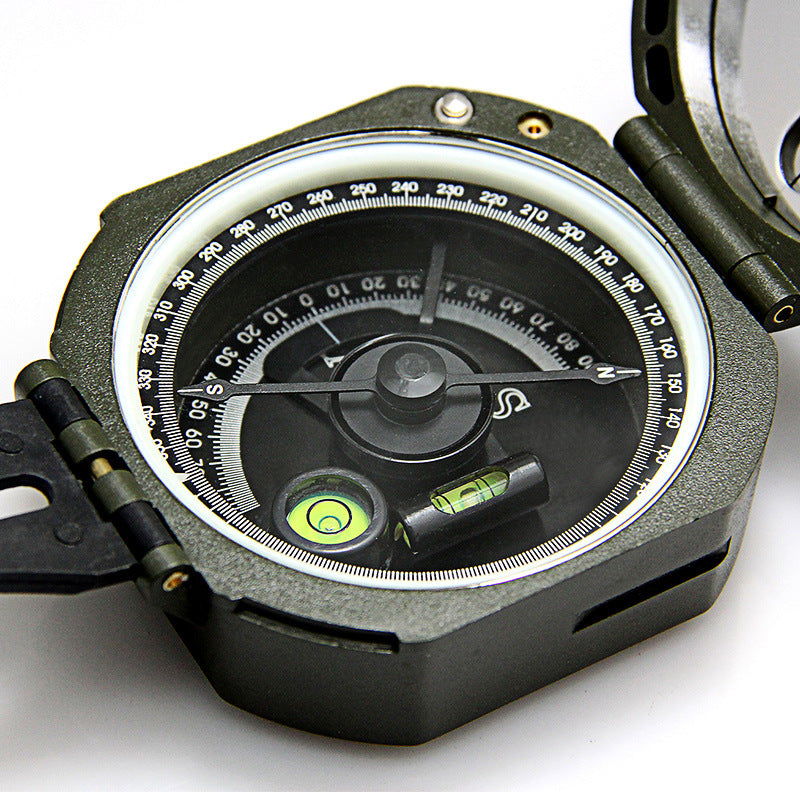 Close-up of a compass with a white background