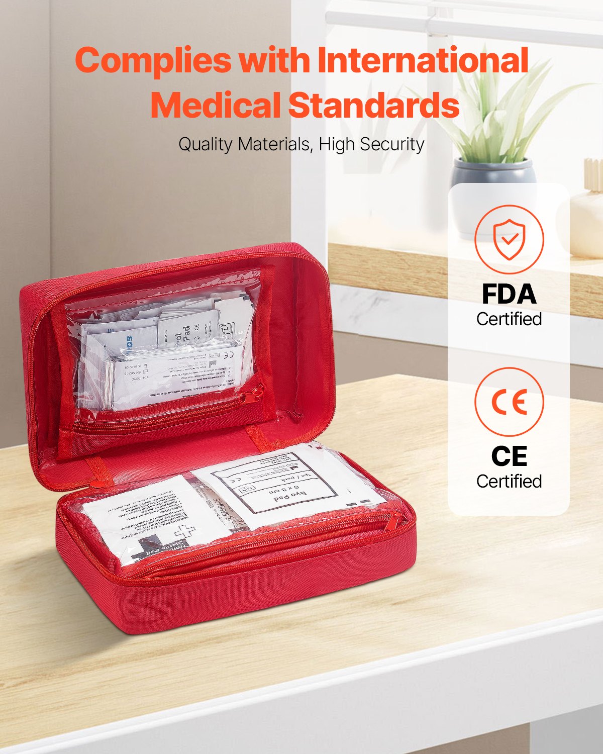 Red first aid kit on a table with certification logos displayed.