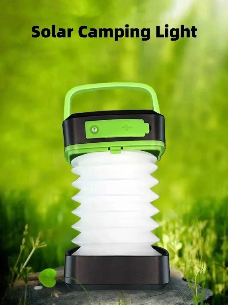 Solar camping light with green handle and base on a natural background
