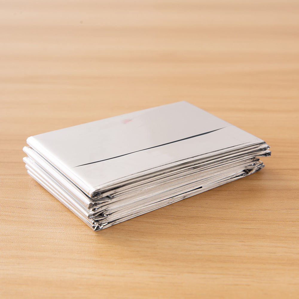Stack of white papers on a wooden surface