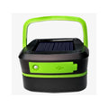 Black and green solar lantern on a white background