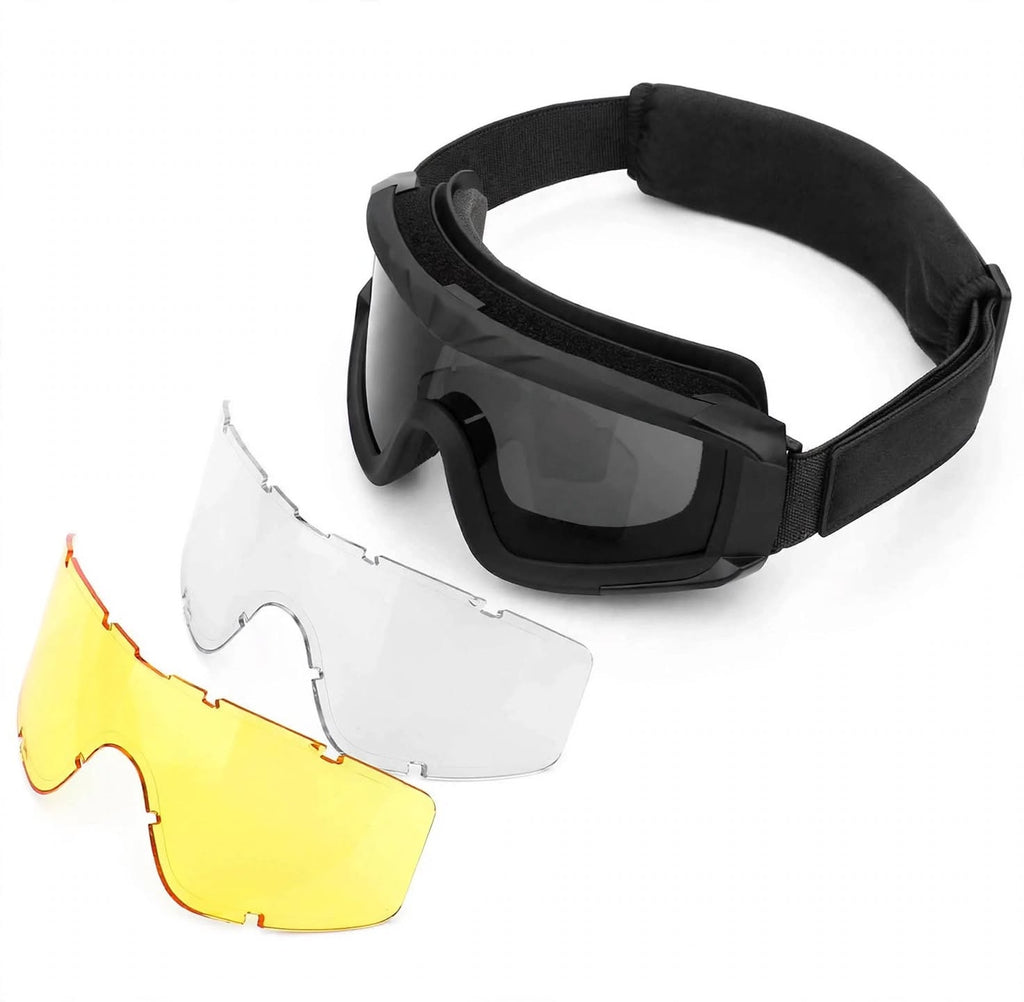 Black protective goggles with a padded head strap, shown alongside two interchangeable shield lenses in clear and yellow on a white background.