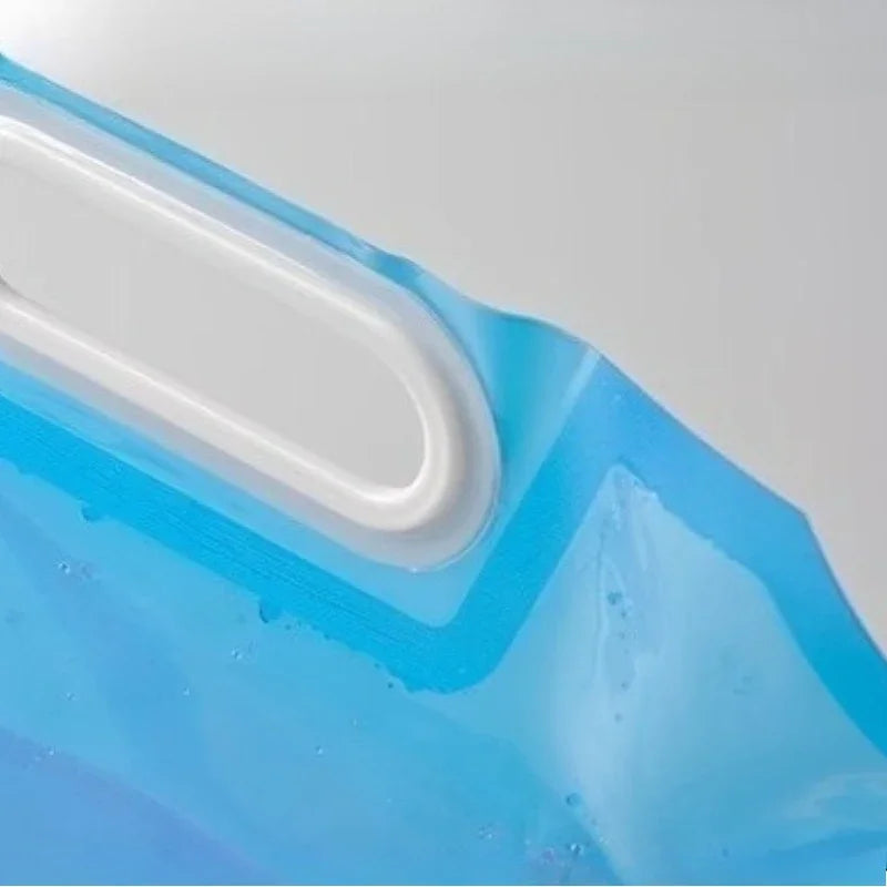 Close-up of a translucent blue flexible bag or pouch attached to a white rigid component, with water droplets visible on the surface.