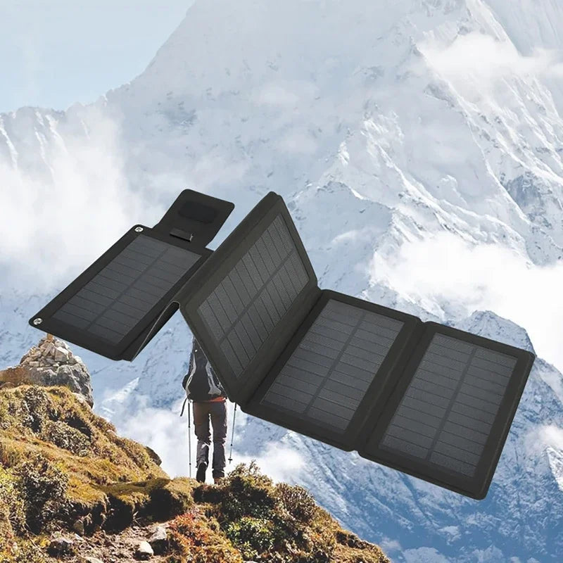 Solar panel on a mountain background with a person hiking.