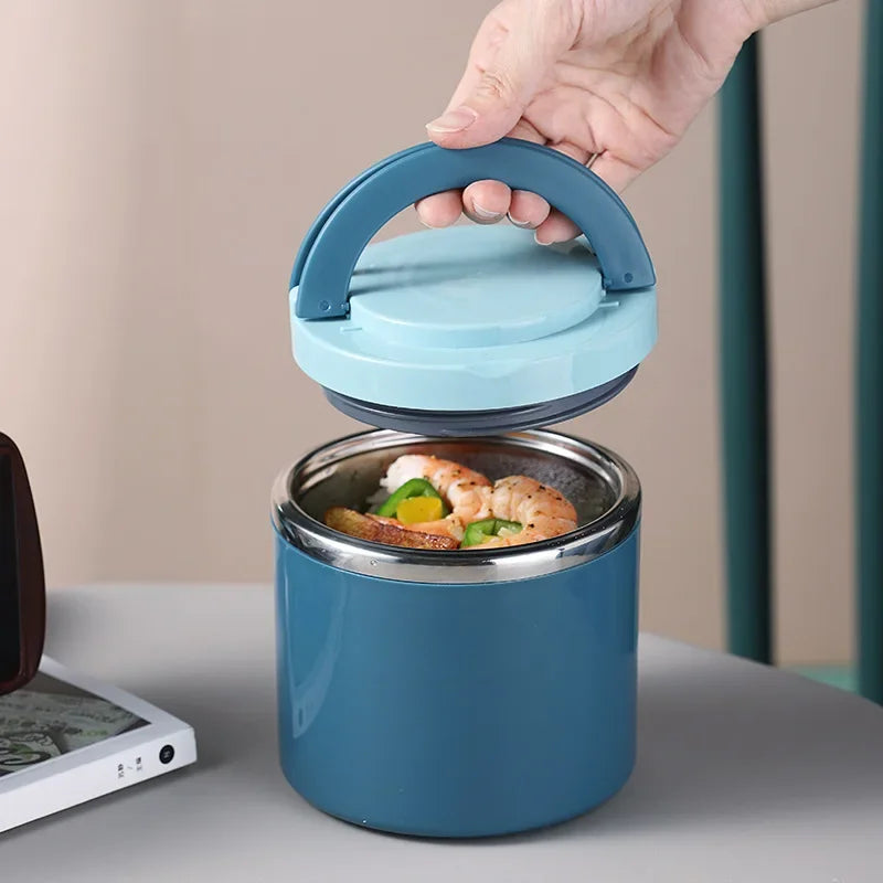 Blue thermos container with food inside, held by a hand on a neutral background