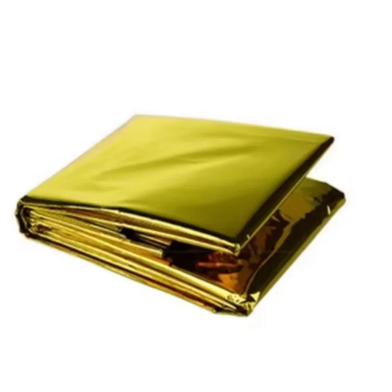A folded metallic gold foil blanket or emergency survival pad shown on a plain white background.
