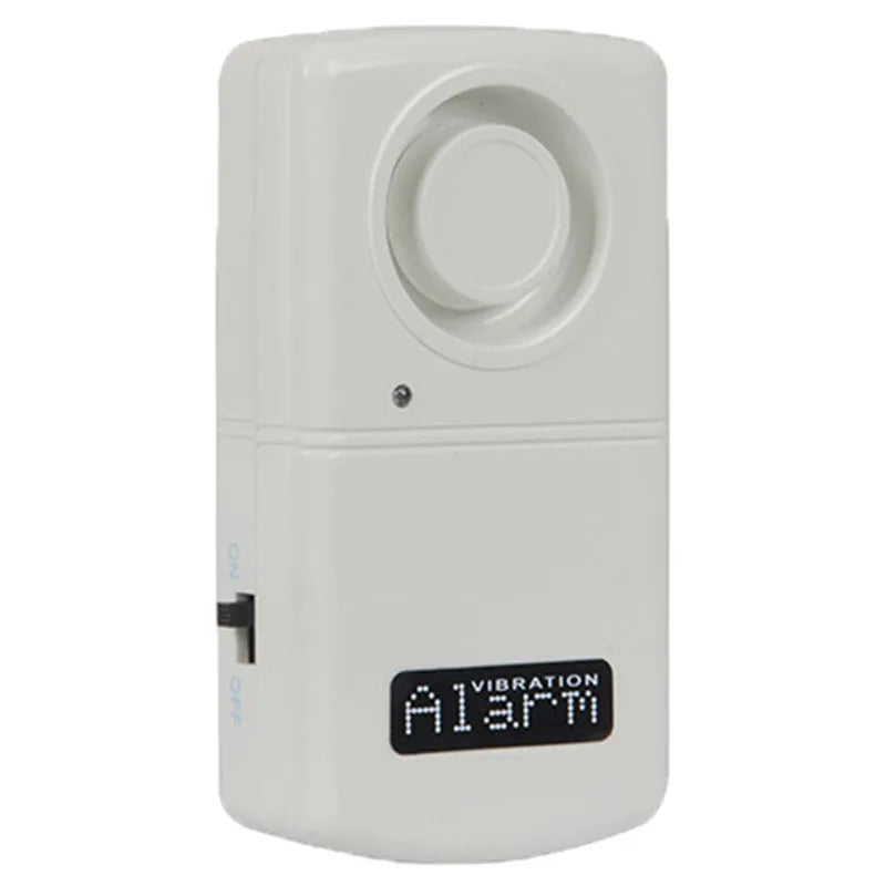 A white vibration detector alarm device with a digital LED display showing 'ALARM' and a side switch, isolated on a white background.