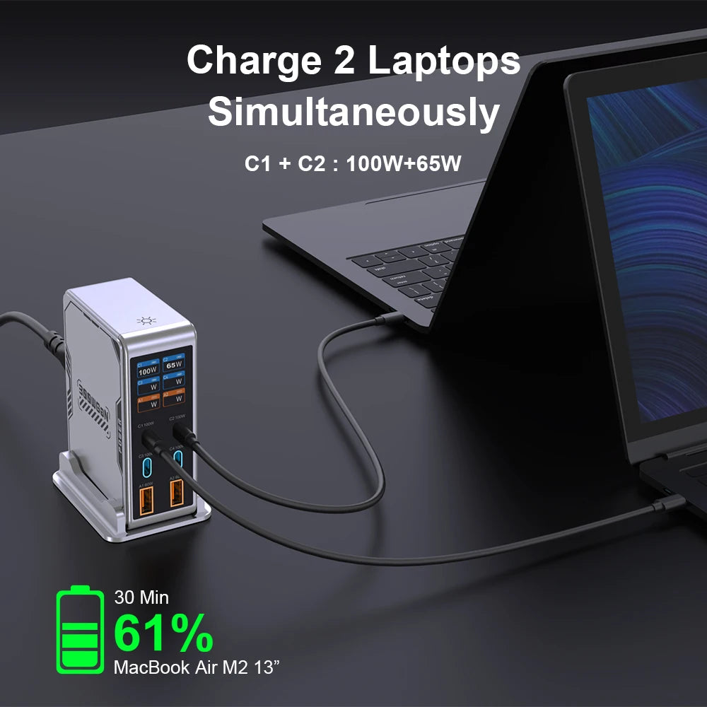 Laptop charging station with two laptops on a dark surface, showing charging speed and power.