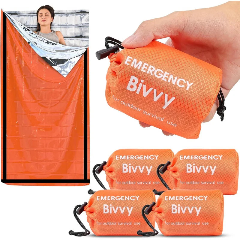 Emergency bivvy bag with packaging and a person using it.