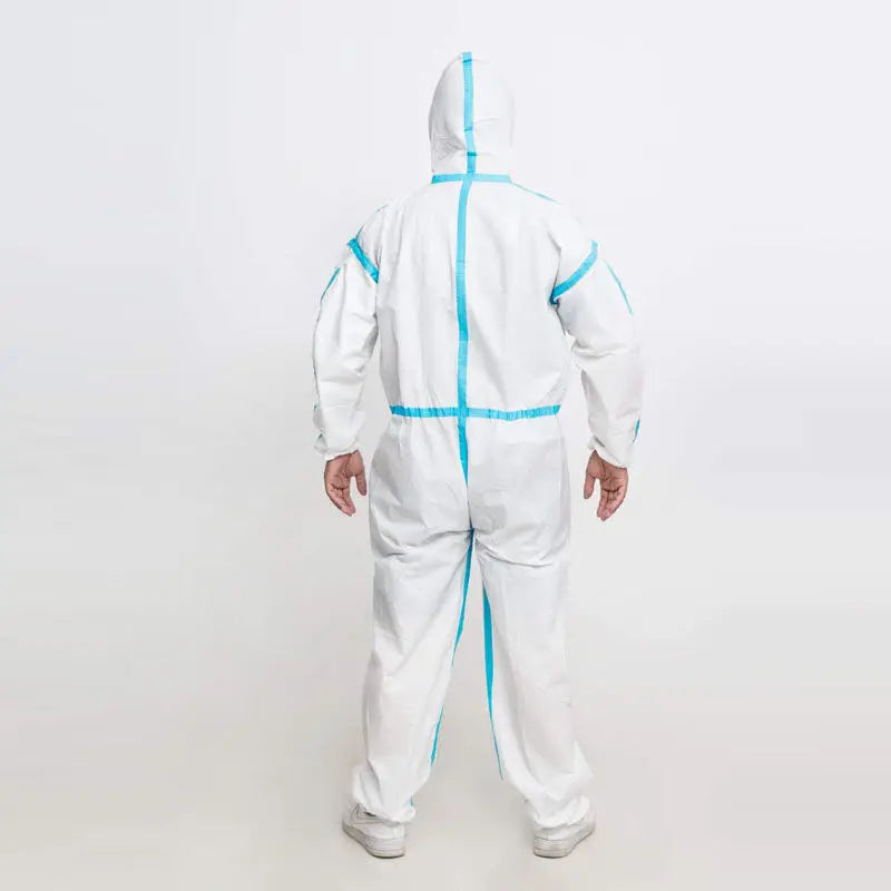 A person shown from the back wearing a white hooded protective coverall with bright blue trim lines, standing against a plain light gray studio background.