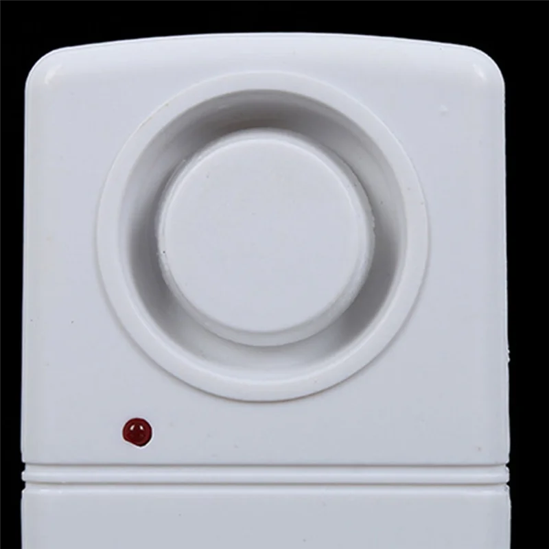 White electronic device with a circular component on a black background