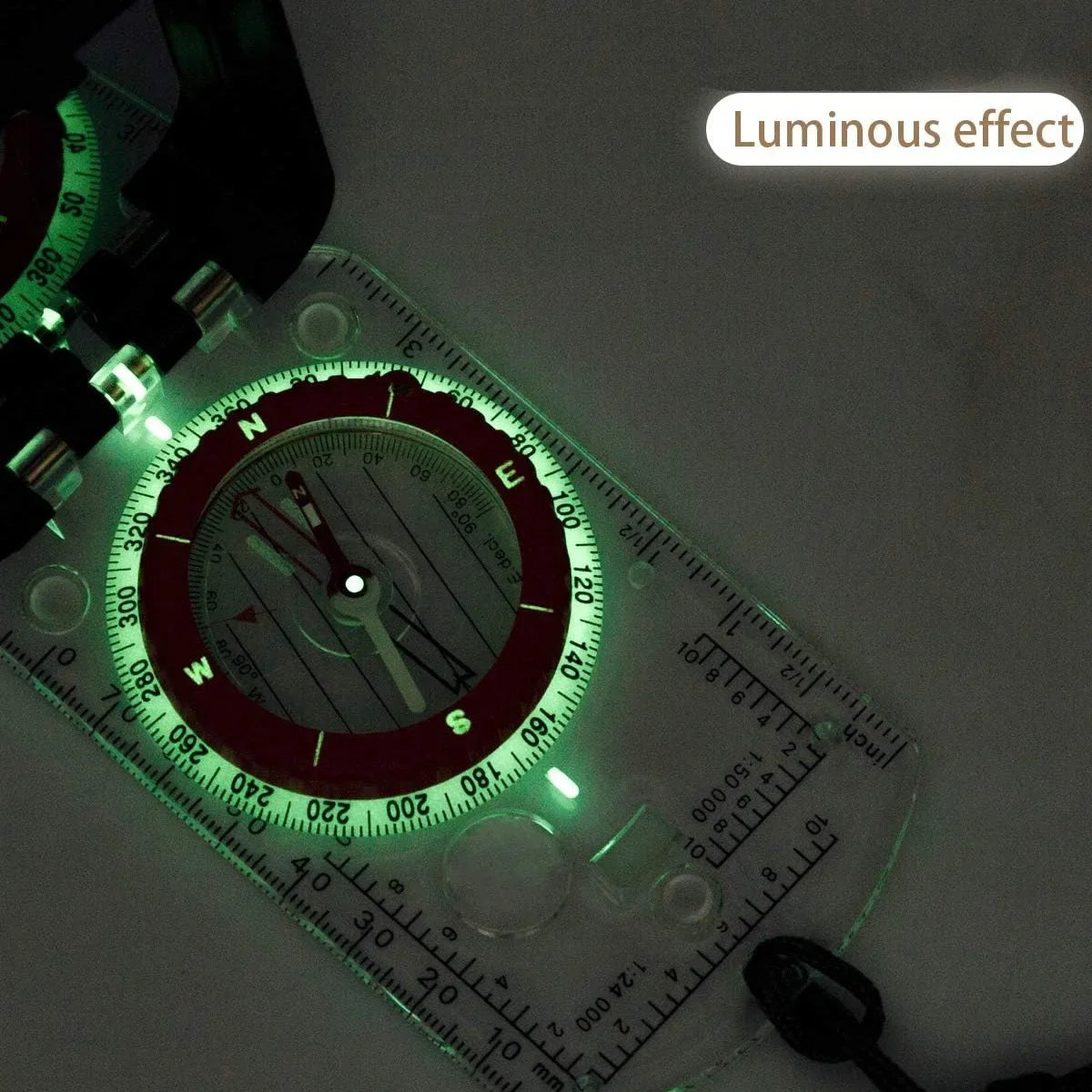 Compass with glowing green light on a dark background