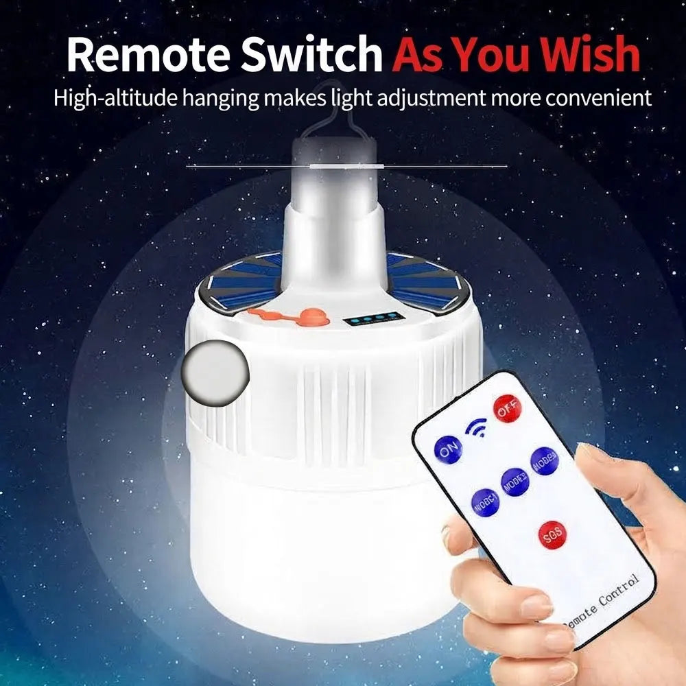 A white solar-powered LED light with a remote control, shown against a starry night sky background. A hand is holding the remote control, and text at the top reads 'Remote Switch As You Wish'.