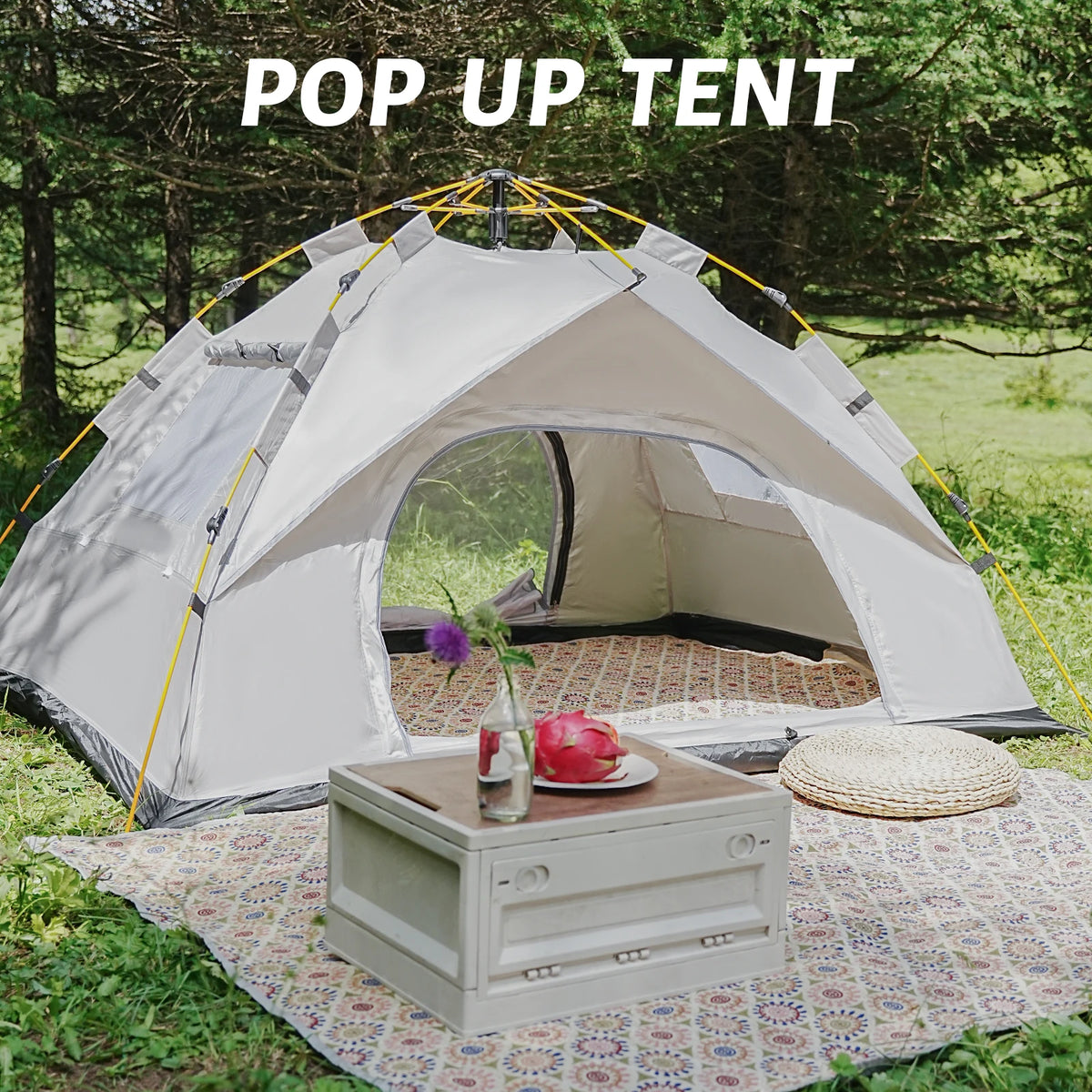 Pop-up tent set up outdoors with a table and decorative items.