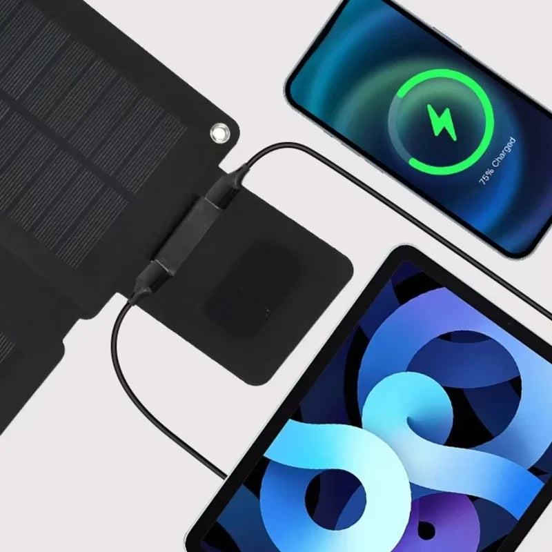 Solar panel charging a smartphone with a charging icon displayed on the screen.