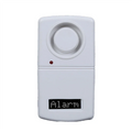 White alarm sensor with digital display on a white background