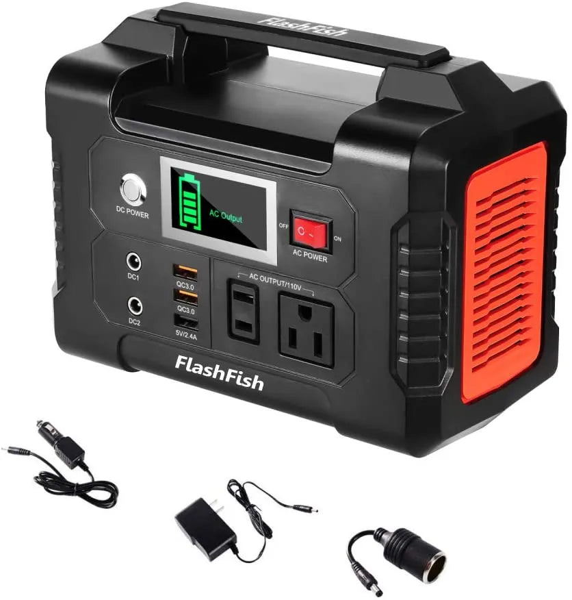 Black and red portable power station with multiple outlets and cables on a white background