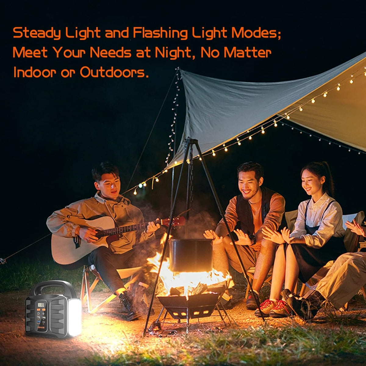 People around a campfire with a portable light source, camping scene at night.